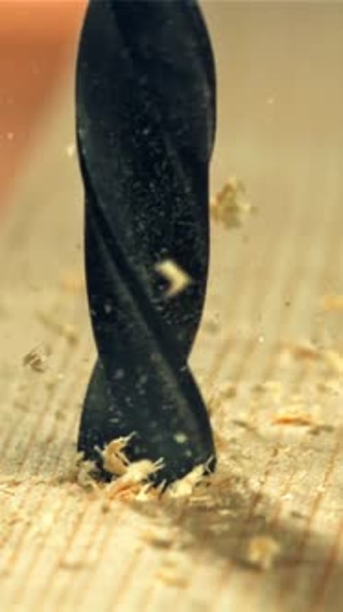 Drilling a Wooden Block in the Workshop Filmed on a Highspeed Camera at 1000 Fps