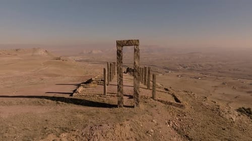 Drone view of the A Day On Earth sculpture made of tall stone columns and massive stone arch gates o