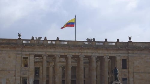 Colombian Flag Flying Above Stone Government Building