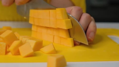 Woman Cook Cuts Pumpkin Into Small Pieces Pumpkin on Board Ingredients for Cooking Pumpkin Cream