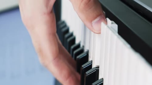Hands playing piano, close up. Musician playing on piano. Vertical video