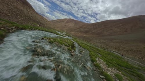 FPV Drone Flies Over a Mountain River in Tibet