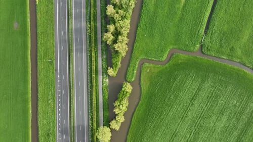 Drone view of a road in the middle of a field. Landscape from a drone. Road and transport.