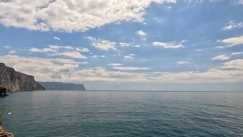 Sea Water Surface Aerial View on Calm Water Surface Camera Flies Over Clear Sea Ocean Sun Glare