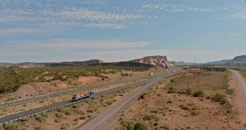 Scenic Highway View Stretches Across Arid Landscape Under Clear Blue Sky