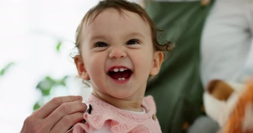 Infant Examined with Stethoscope in Bright Home Setting