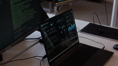 Screens with Programming Codes and Digital Interface on Computers in Office