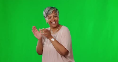 Dancing, green screen and happy or excited woman dance in celebration after winning isolated