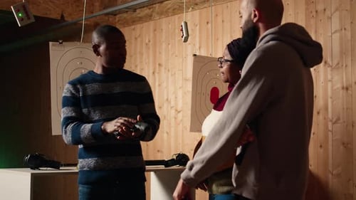 Shooting Gallery Expert Demonstrating How to Safely Reload Pistol and Cock Gun