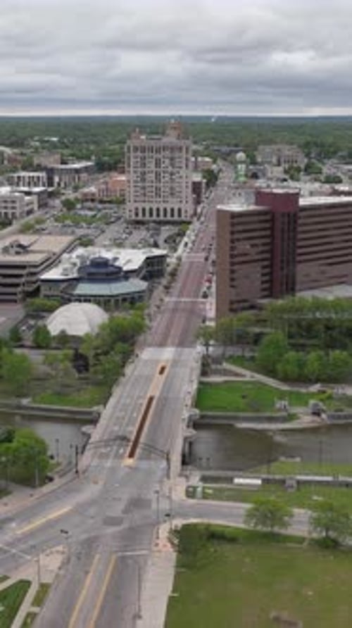 Reel Flint Michigan aerial drone hyperlapse moving right to left over city street