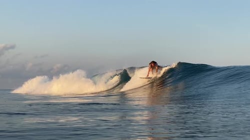 Young Man Surfing in the Ocean
