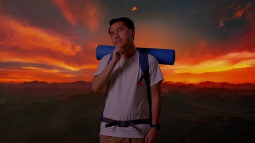 Asian Male Thinking About Something And Looking Around On Top Mountain