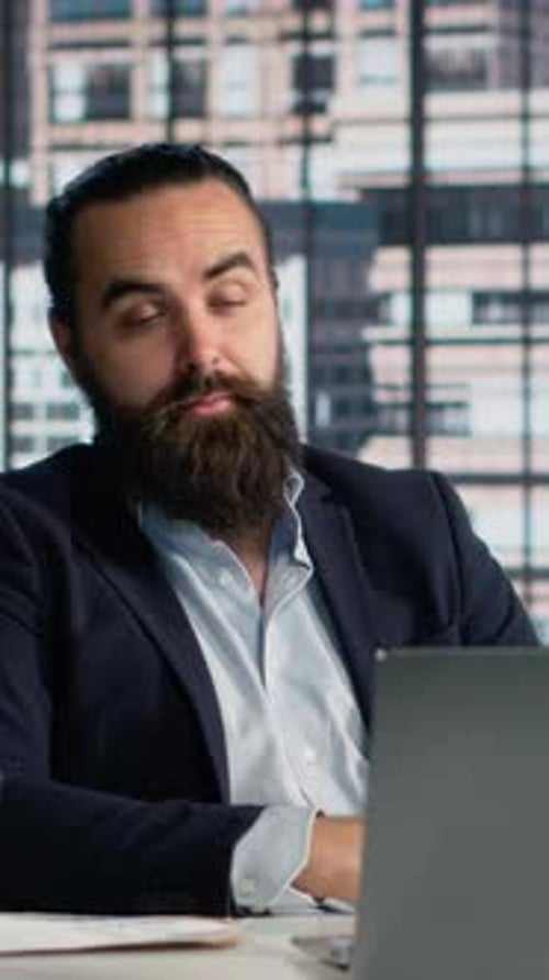 Man In Office Talking During a Video Conference