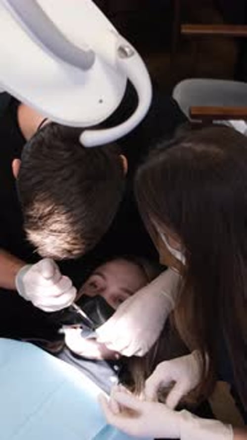 Dentist Performs Procedure on Woman at Clinic