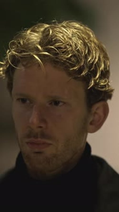 Portrait of a Sad Man is Standing on Street at