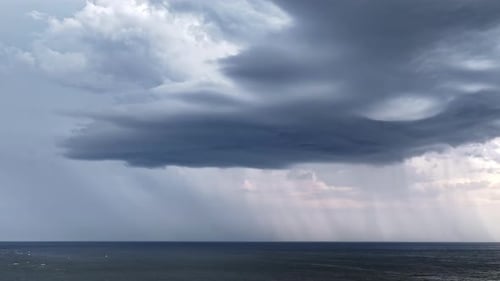 Stormy Gray Clouds Over The Sea. Timelapse