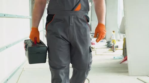 Builder Engineer Architect with Tools Walk on a Construction Site Construction Worker at Modern