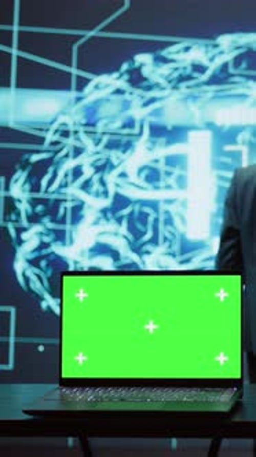 Vertical Video Teamworking AI Technicians Using Green Screen Laptop for Business Data Analysis