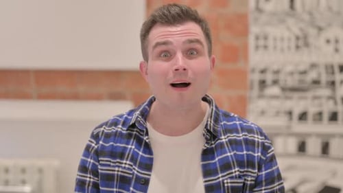 Man Expresses Excitement, Clenches Fists