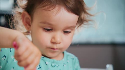 Adorable Child Mixing or Stirring Something Close Up