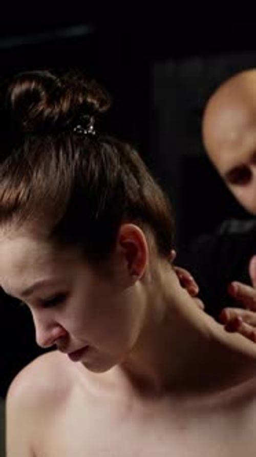 Professional Physiotherapist Providing Neck Manipulation Gently Massaging Cervical Area During