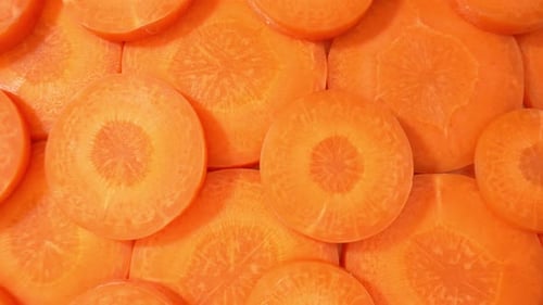 Sliced Carrots Creating an Orange Vegetable Background