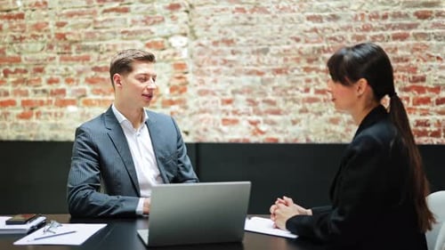 Business Meeting Professional Man and Woman Discuss Project in Modern Office