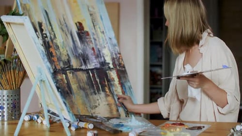 Skilled Artist Making Abstract Painting on Canvas at Workshop