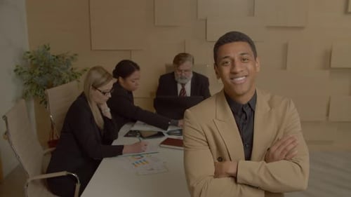 Smiling Confident African American Male Business Executive Posing at Office
