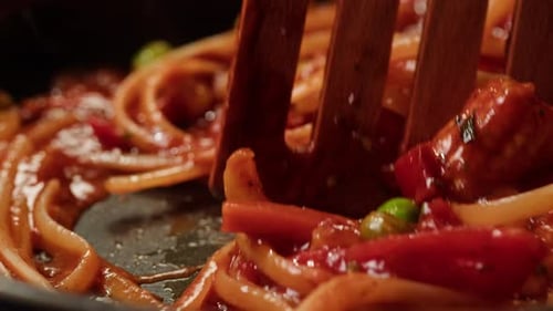 Close Up Pasta in Pan being Stirred