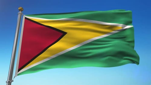 Guyana Flag Waving Against Clear Blue Sky