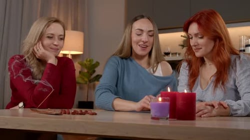 Lovely Middle Aged Female Fortune Teller Tarot Card Reading to Woman at Home