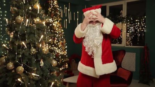 Santa Claus Dancing, Adjusting Costume near Christmas Tree
