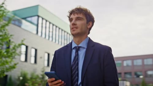 Elegant Director Browsing Smartphone Walking City Area Closeup Successful Man