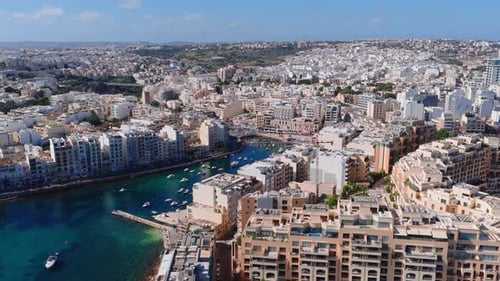 Aerial Sweep of Sliema Malta Harbor Boats and Waterfront