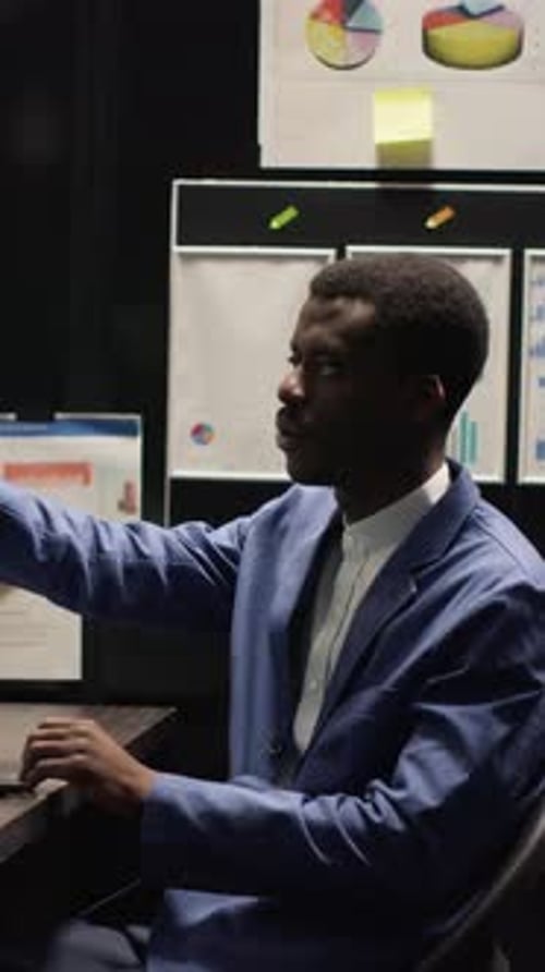 Young adult interacts with futuristic touch screen display