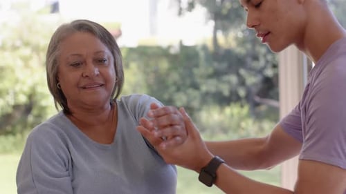 Wrist Manipulation by Young Adult for Senior Woman