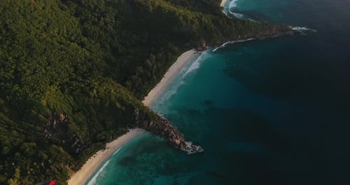 Aerial view over sandy white beaches on La Digue Island in the Seychelles.
