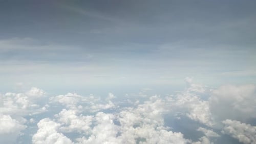 view of sky with white puffy cloud and sun light above sky.cloudscape in summer