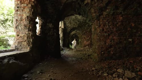 Man Walking Through Ancient Stone Ruins Concept of Historical Place