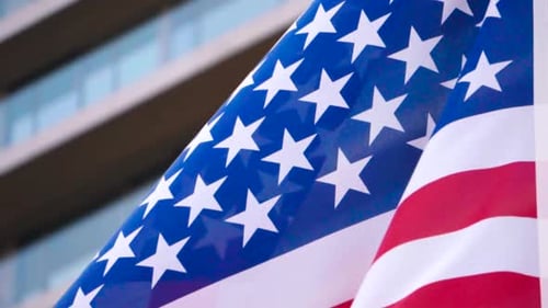 American Flag Waving Close Up in Urban Setting