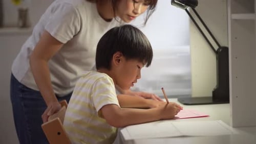 Parent and child writing a picture diary ​