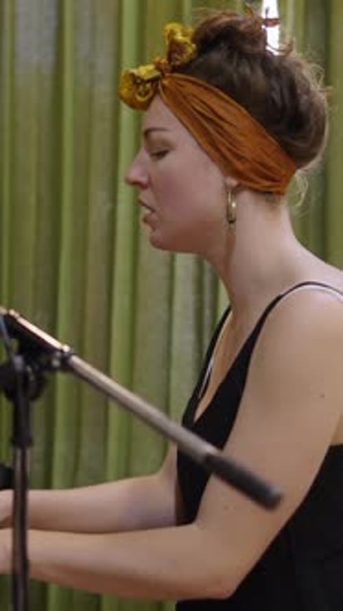 Woman Sings and Plays Piano in Studio