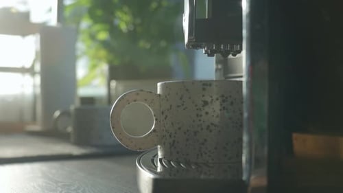 Close-up of Coffee Machine Brewing into Ceramic Cup