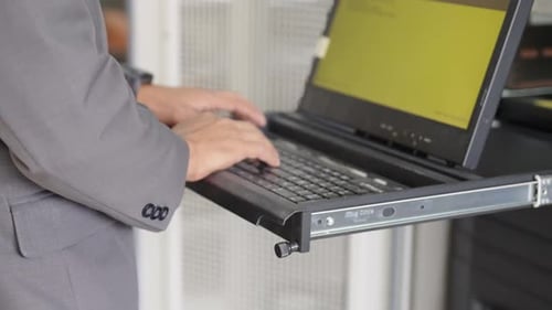 Cropped view hands working on laptop, typing text on keyboard