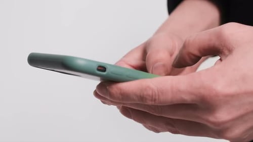 Hands Holding Smart Phone and Typing