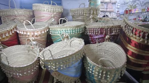 Colorful And Stylish Handmade Baskets At Tunisia Marketplace. Pan Left