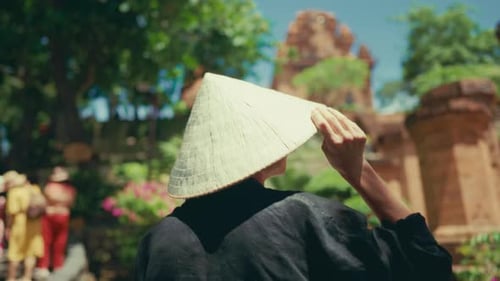 Touristic Trip to Asia Exploring Vietnam Back View of Female Tourist in Park Young Adult Woman