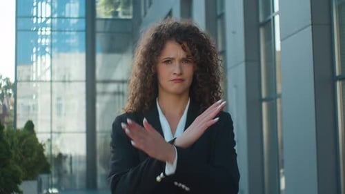Woman Says No with Arms Crossed Outdoors