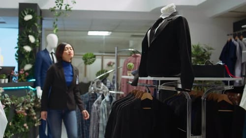 Woman Browsing Clothes in Upscale Retail Store